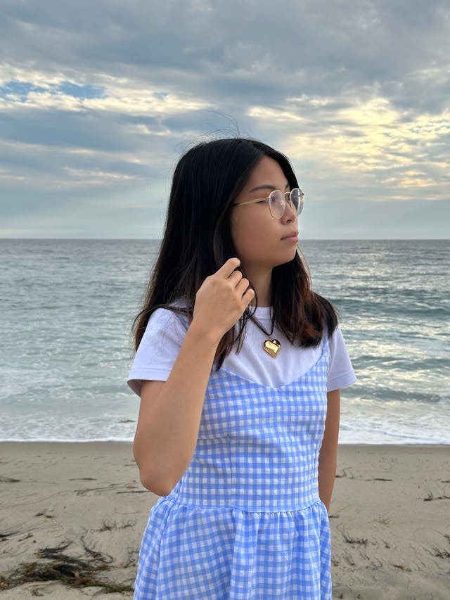 Shelly Liu in front of the ocean
